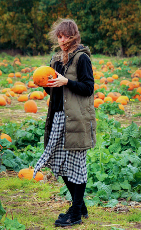 mom on pumpkin field