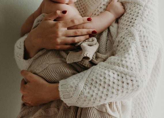 a mother with a child in hands